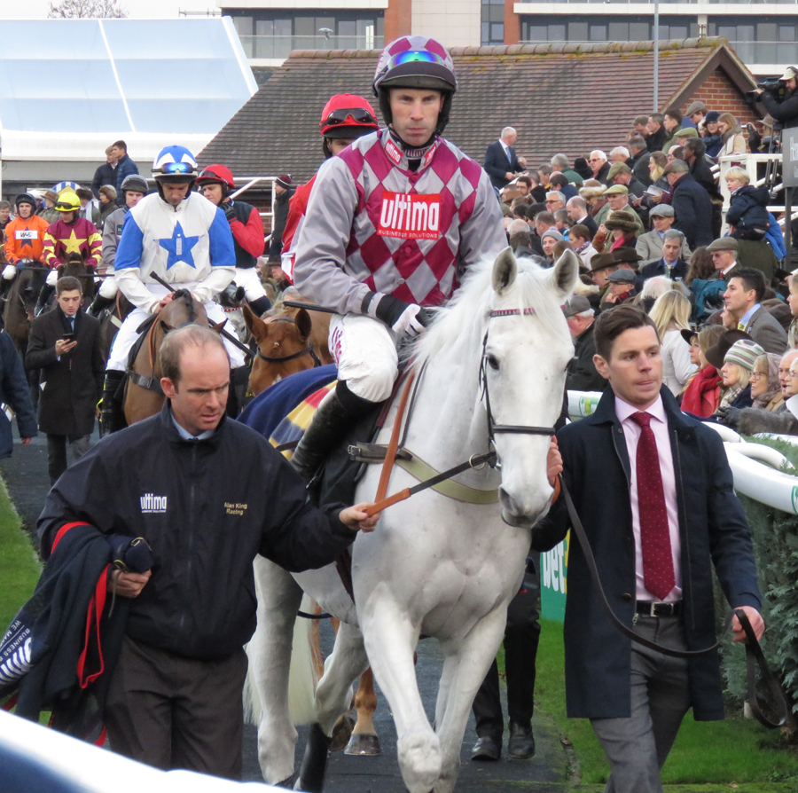 Smad Place & Wayne Hutchinson leave the parade ring for the last running of the Hennessy Gold Cup - Newbury racecourse, 26 November 2016