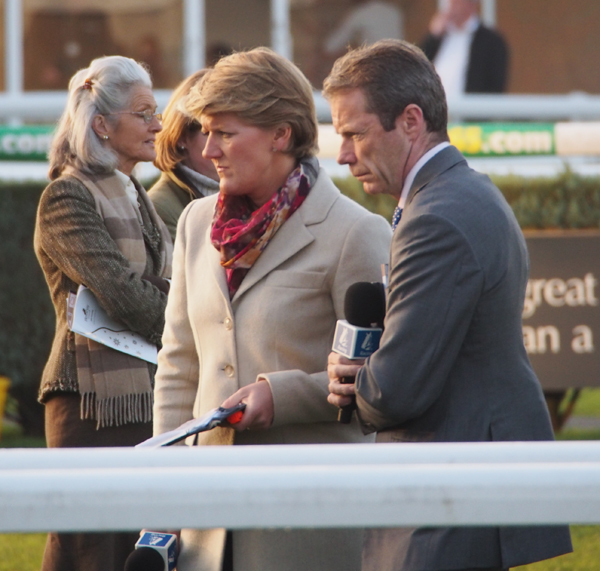 Channel Four's Clare Balding & Mick Fitzgerald watch the Gold Cup on a TV monitor